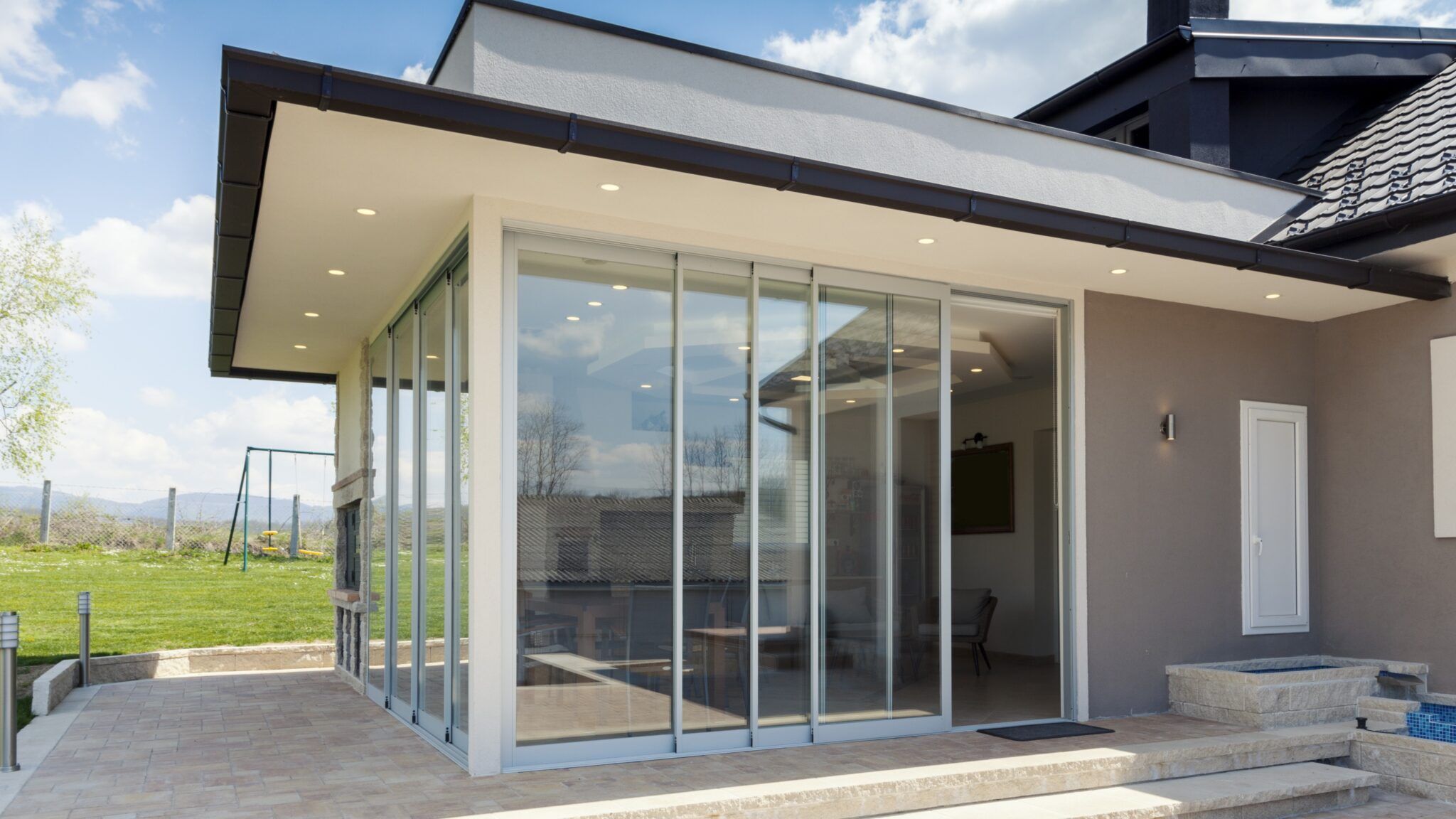 Home exterior with new glass patio doors installed by GoGlass in Dover, DE