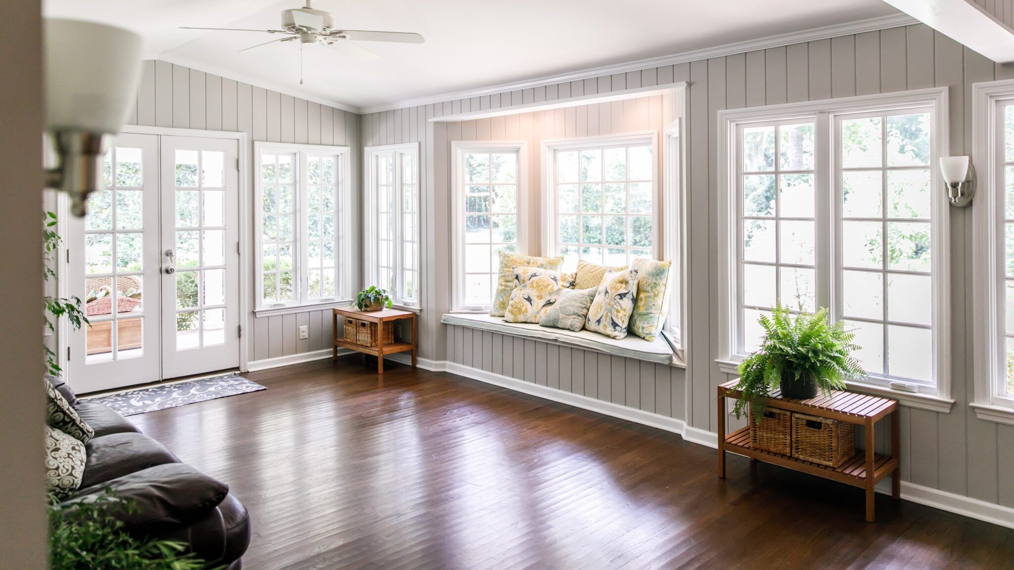 Interior sunroom with newly installed residential glass replacement windows and door in Dover, DE by GoGlass