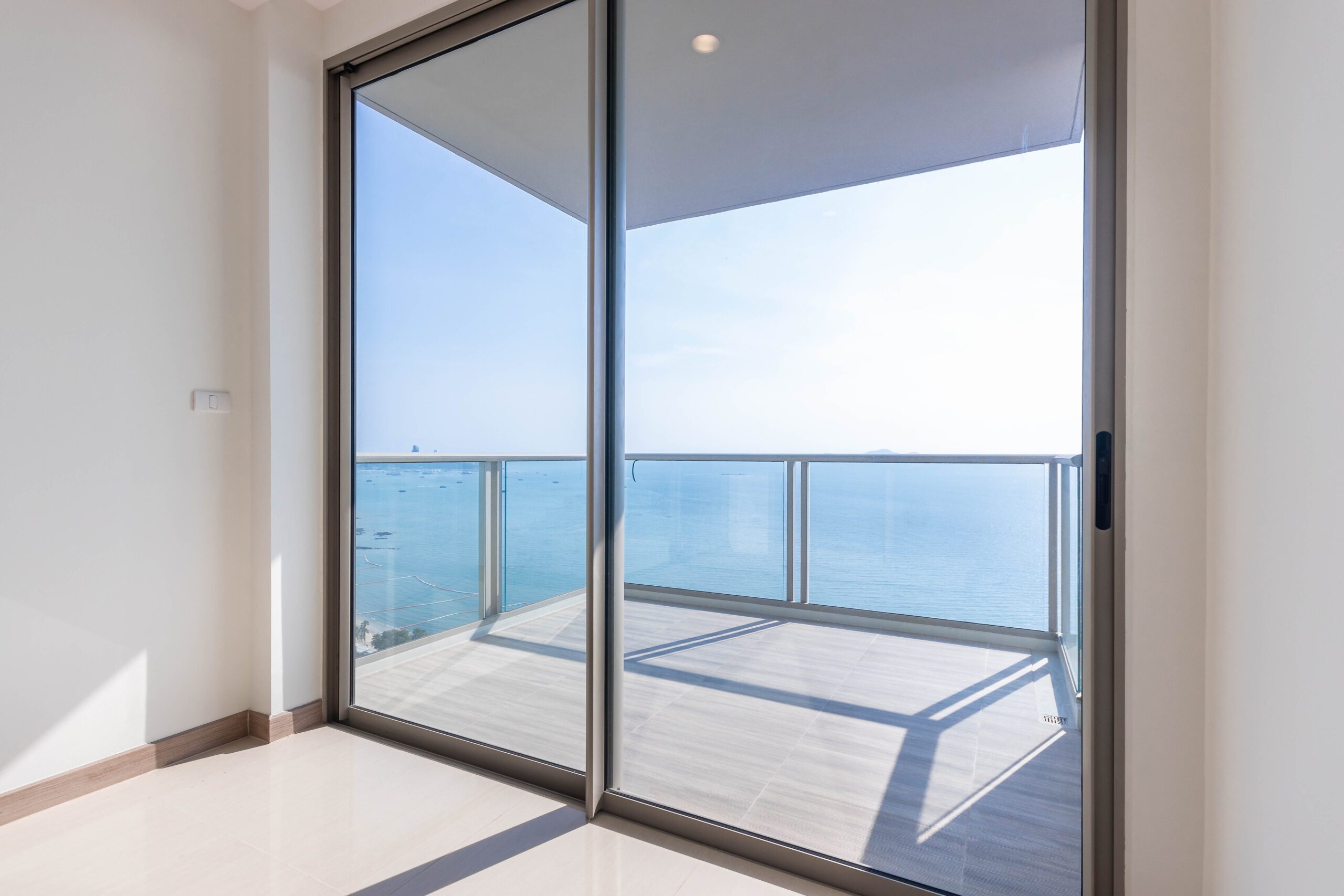 Sliding glass patio doors overlooking the sea