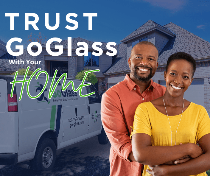 Couple standing outside their home with a GoGlass van in the background, with the text saying "Trust GoGlass with you Home"