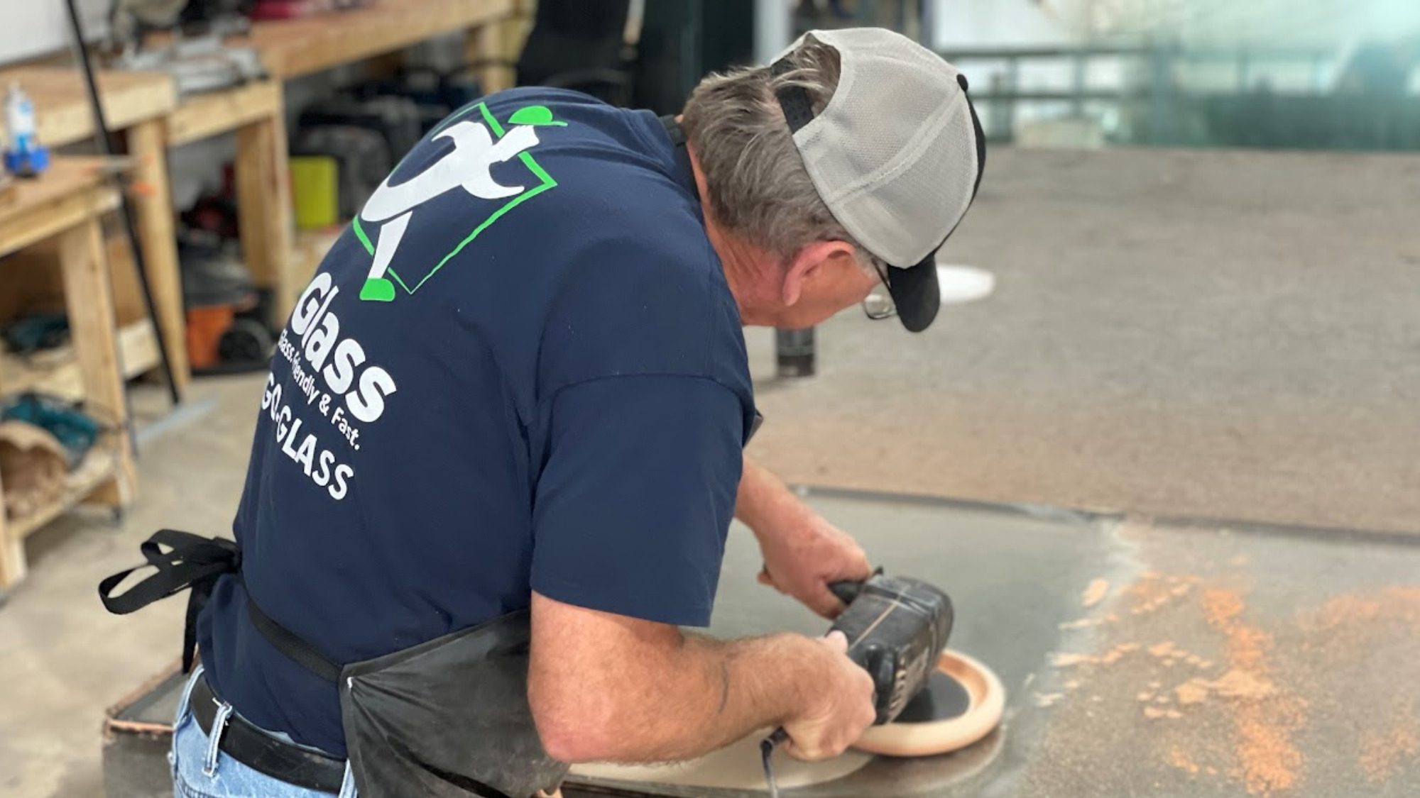 A full-time GoGlass employee prepares a new insulated glass window for installation