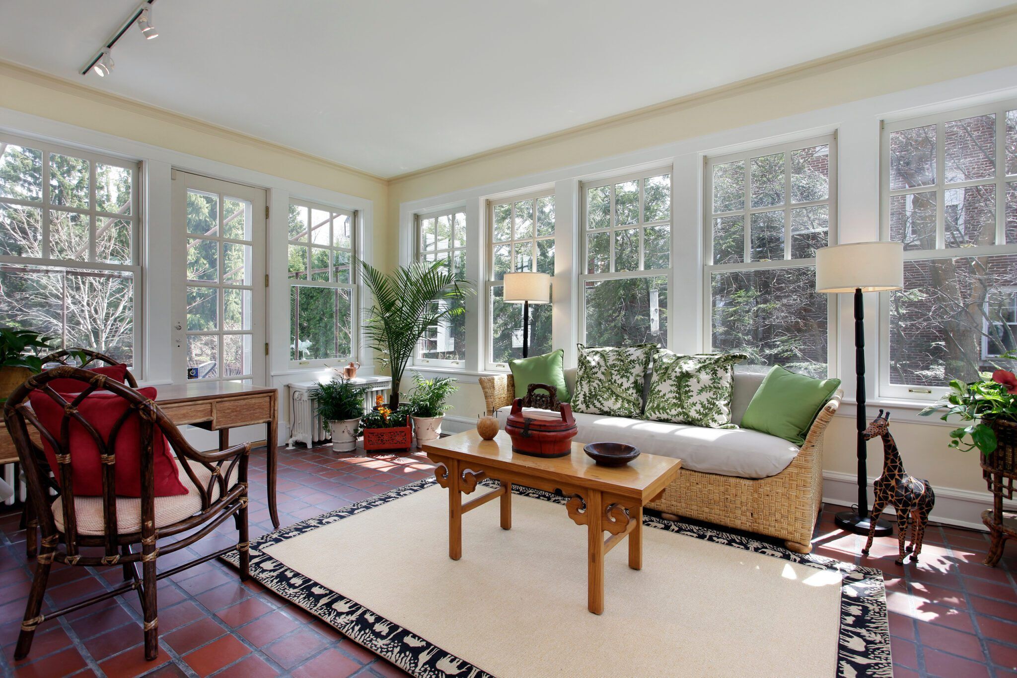 Sunroom with red brick flooring