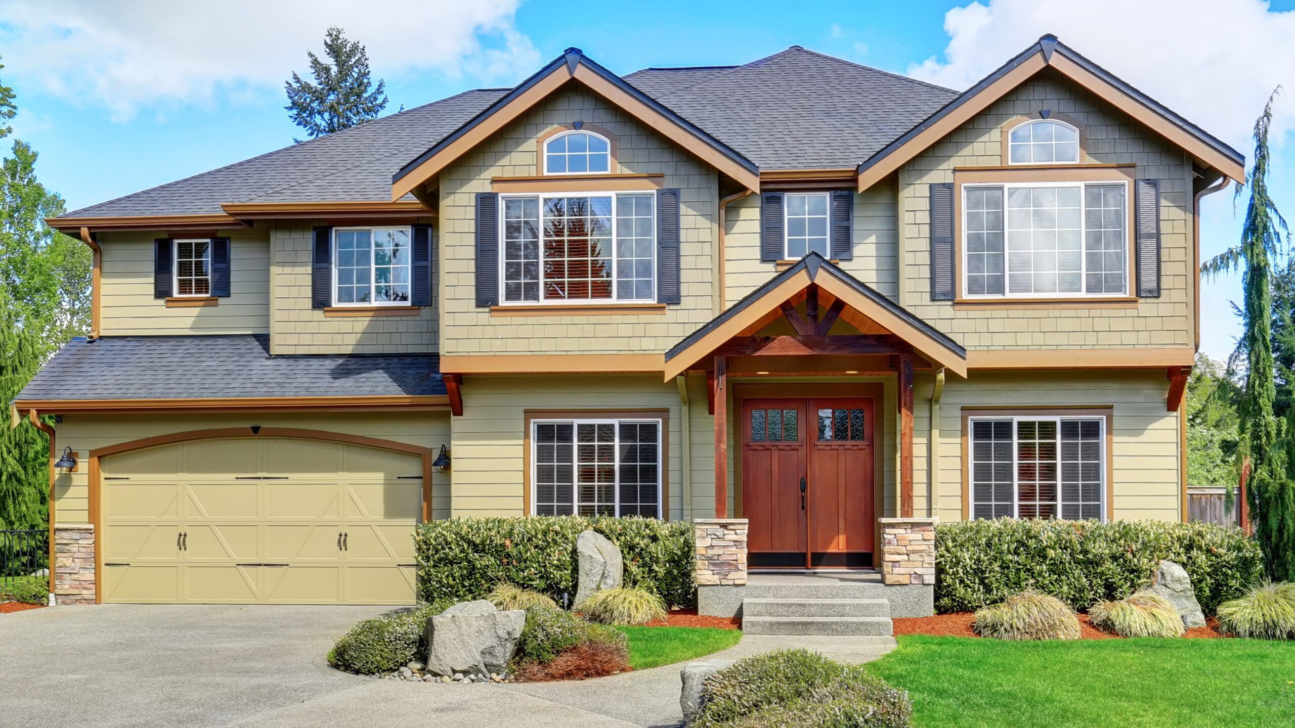 Luxurious home with large driveway.